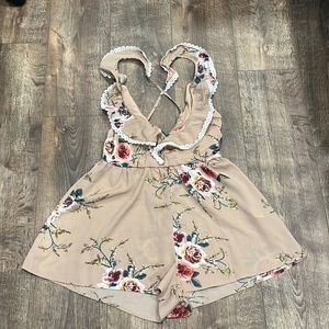Romper size:4 cream with floral print.